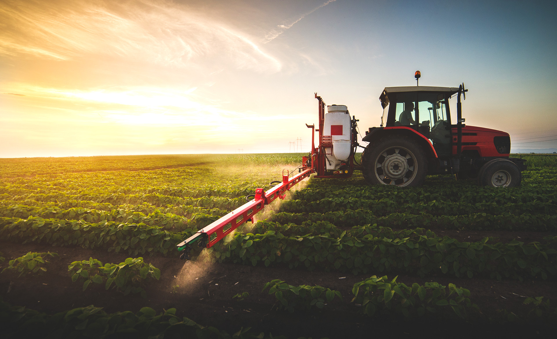 regional pesticide manufacturing tractor spraying in field