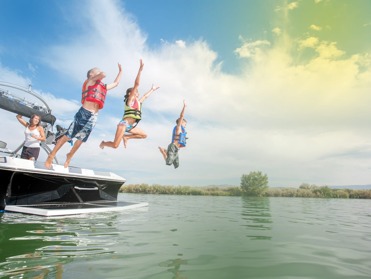 Kids Jumping into Lake